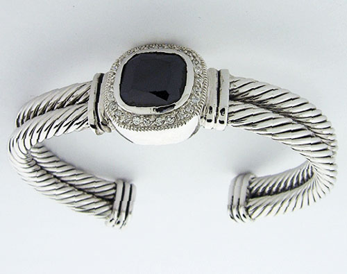High-quality sterling silver double cable bracelet with a central faceted black onyx and pave diamonds, showcasing exquisite historical craftsmanship.